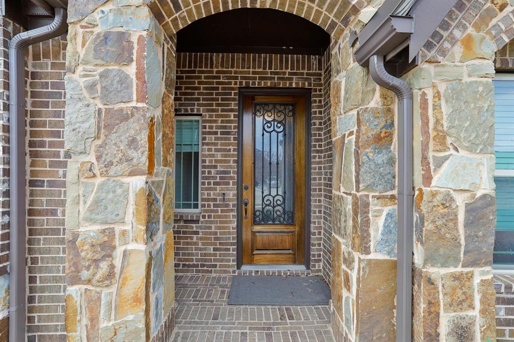 2425 Turning Leaf Lane Midlothian, TX 76065 - Photo 3 of 29 View of exterior entry with brick siding and stone siding