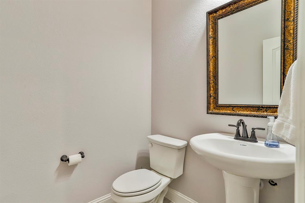 2425 Turning Leaf Lane Midlothian, TX 76065 - Photo 8 of 29 Half bath featuring toilet and a textured wall