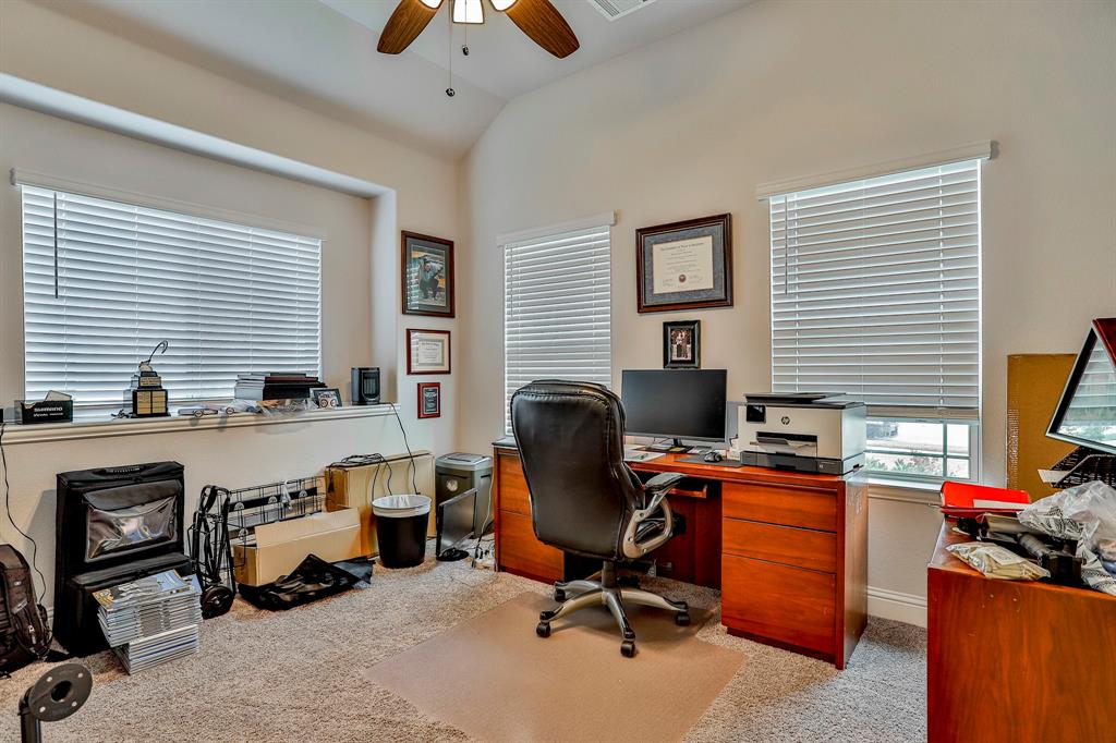 2425 Turning Leaf Lane Midlothian, TX 76065 - Photo 10 of 29 Home office with light colored carpet, ceiling fan, and vaulted ceiling