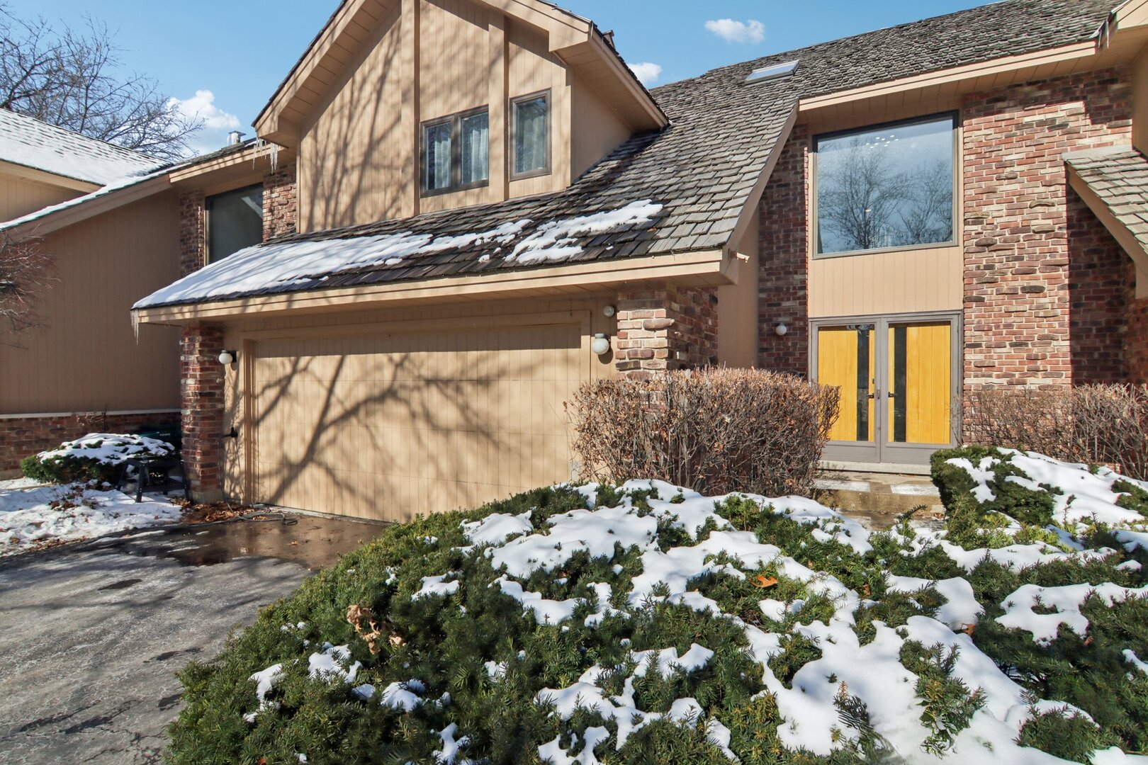 a front view of a house with a yard