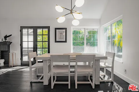 a kitchen with stainless steel appliances granite countertop white cabinets and a granite counter tops
