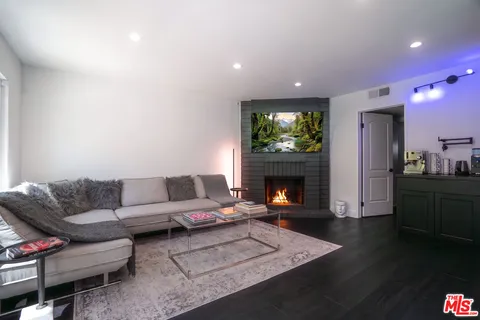a spacious bedroom with a bed and a view