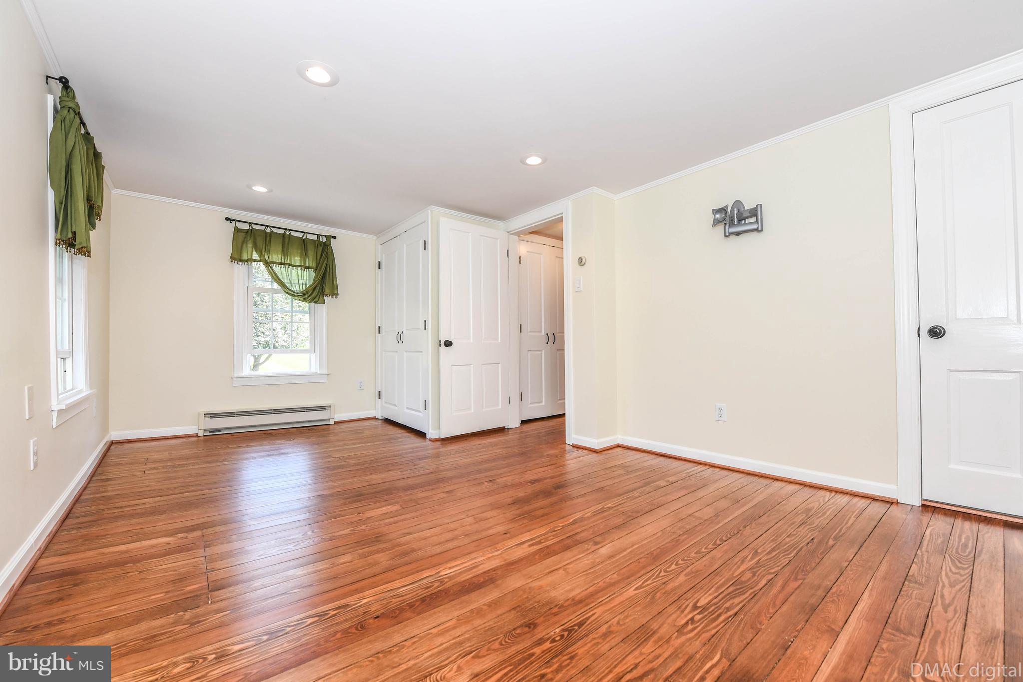 6316 Clevelandtown Road Boonsboro, MD 21713 - Photo 14 of 30 a view of an empty room with wooden floor and a window