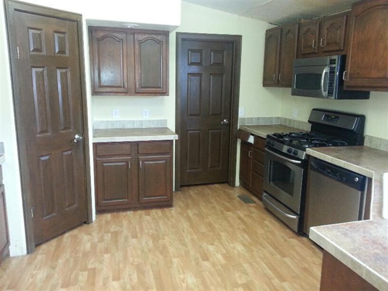 102 Cut Throat Loop Gypsum, CO 81637 - Photo 2 of 5 a kitchen with stainless steel appliances granite countertop a stove refrigerator and cabinets