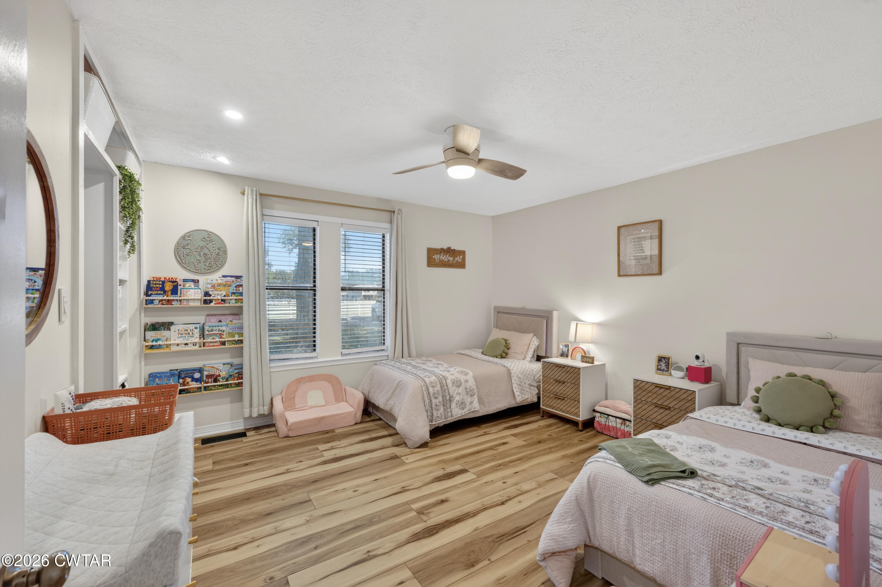 778 Mifflin Road Jackson, TN 38301 - Photo 12 of 23 a bedroom with bed and wooden floor