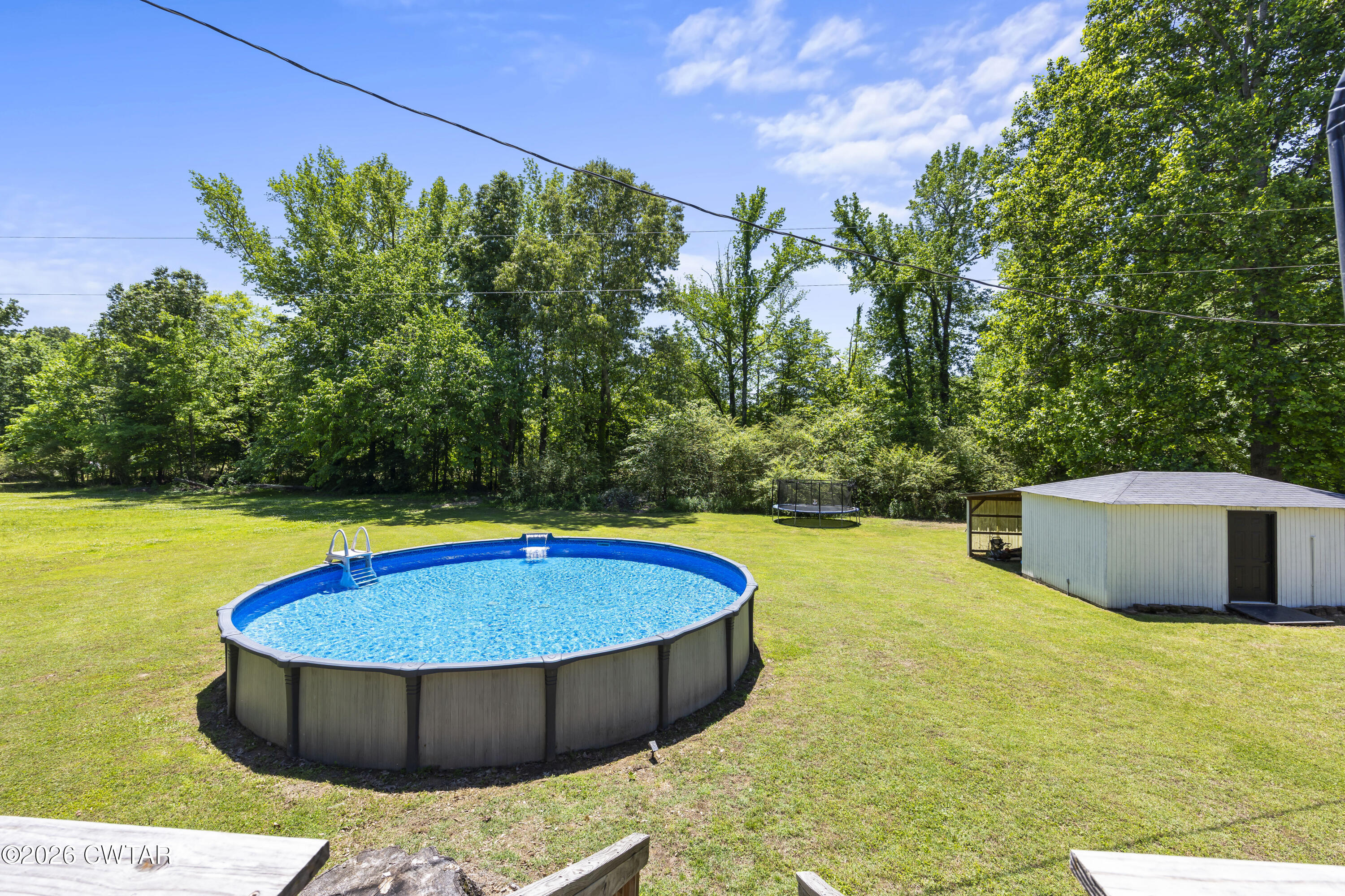 778 Mifflin Road Jackson, TN 38301 - Photo 21 of 23 a view of a swimming pool with an outdoor space and seating area