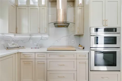 a bathroom with a tub a sink and a shower