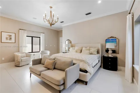 a living room with furniture a garden view and a potted plant