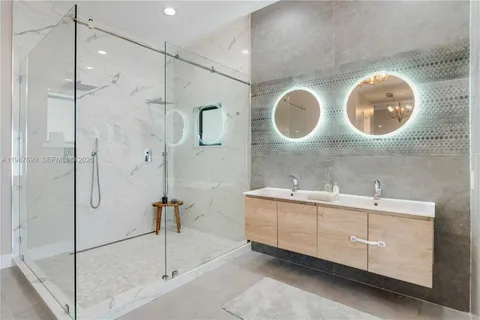 a view of a house with swimming pool and sitting area