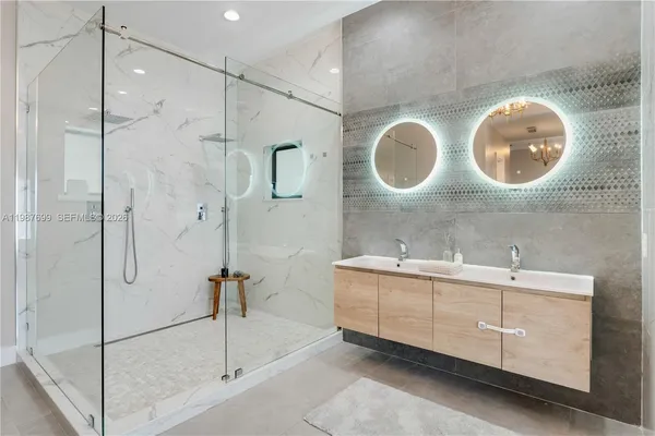 a view of a house with swimming pool and sitting area