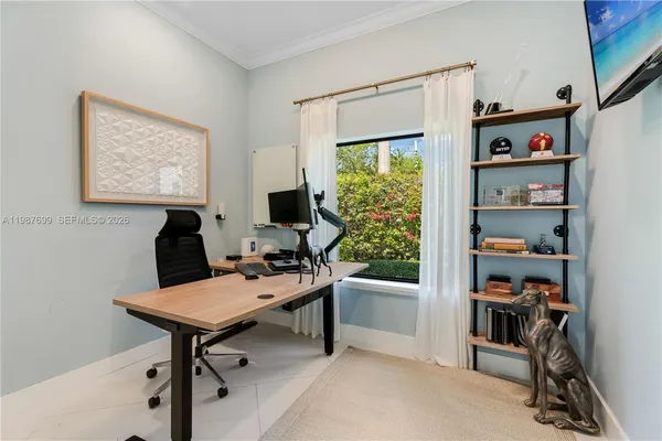a view of a patio with table and chairs potted plants with floor to ceiling window
