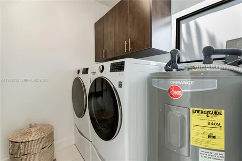 a front view of a house with yard and green space