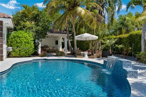 a view of a city with lush green forest