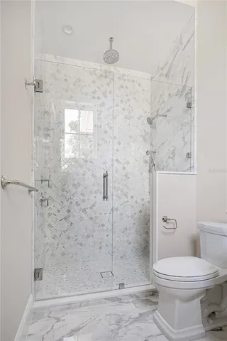 a view of a patio with table and chairs and potted plants
