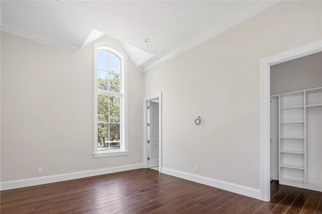 a living room with a fireplace and a large window