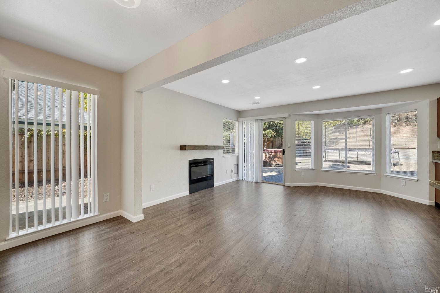 131 Brigantine Road Vallejo, CA 94591 - Photo 1 of 1 a view of an empty room with wooden floor and a window