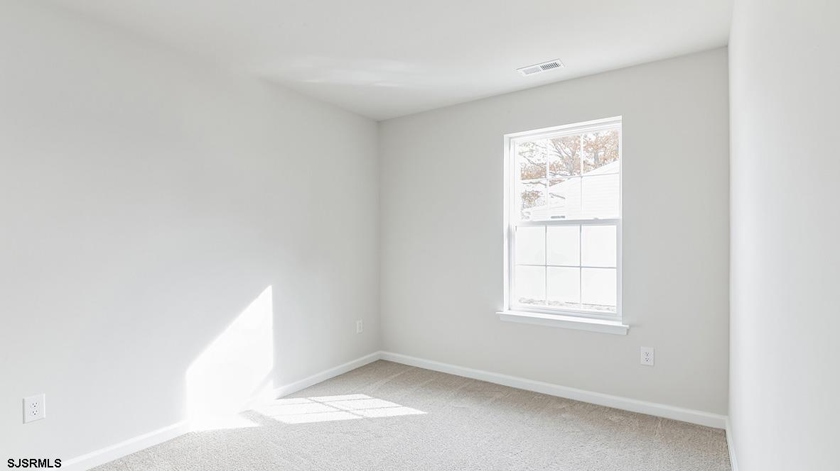 103 West Drumbed Road Villas, NJ 08251 - Photo 12 of 23 a view of an empty room with a window