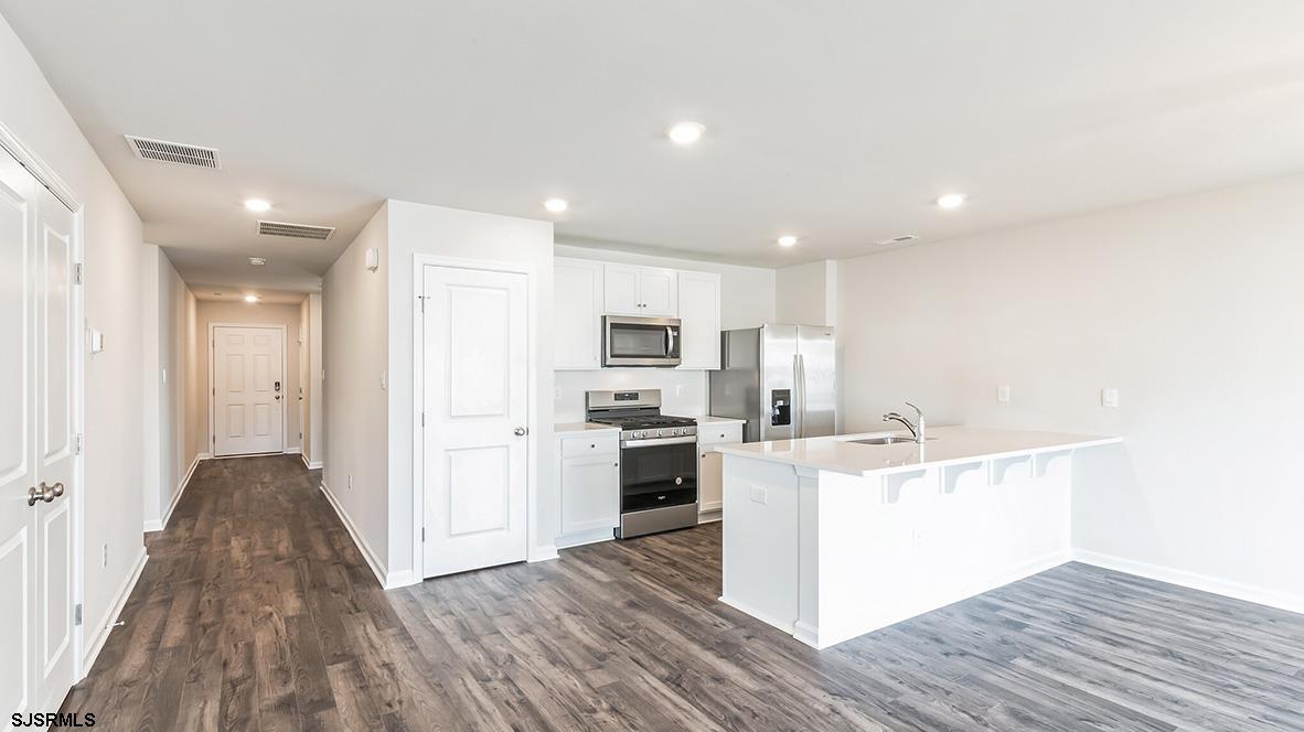 103 West Drumbed Road Villas, NJ 08251 - Photo 23 of 23 a kitchen with a sink wooden floor and stainless steel appliances