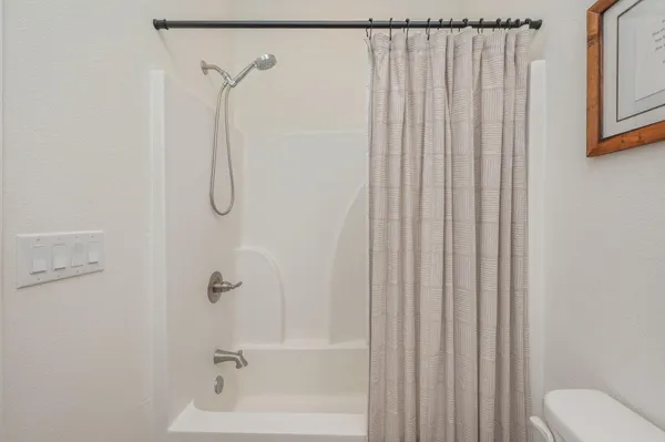 a bathroom with a shower curtain