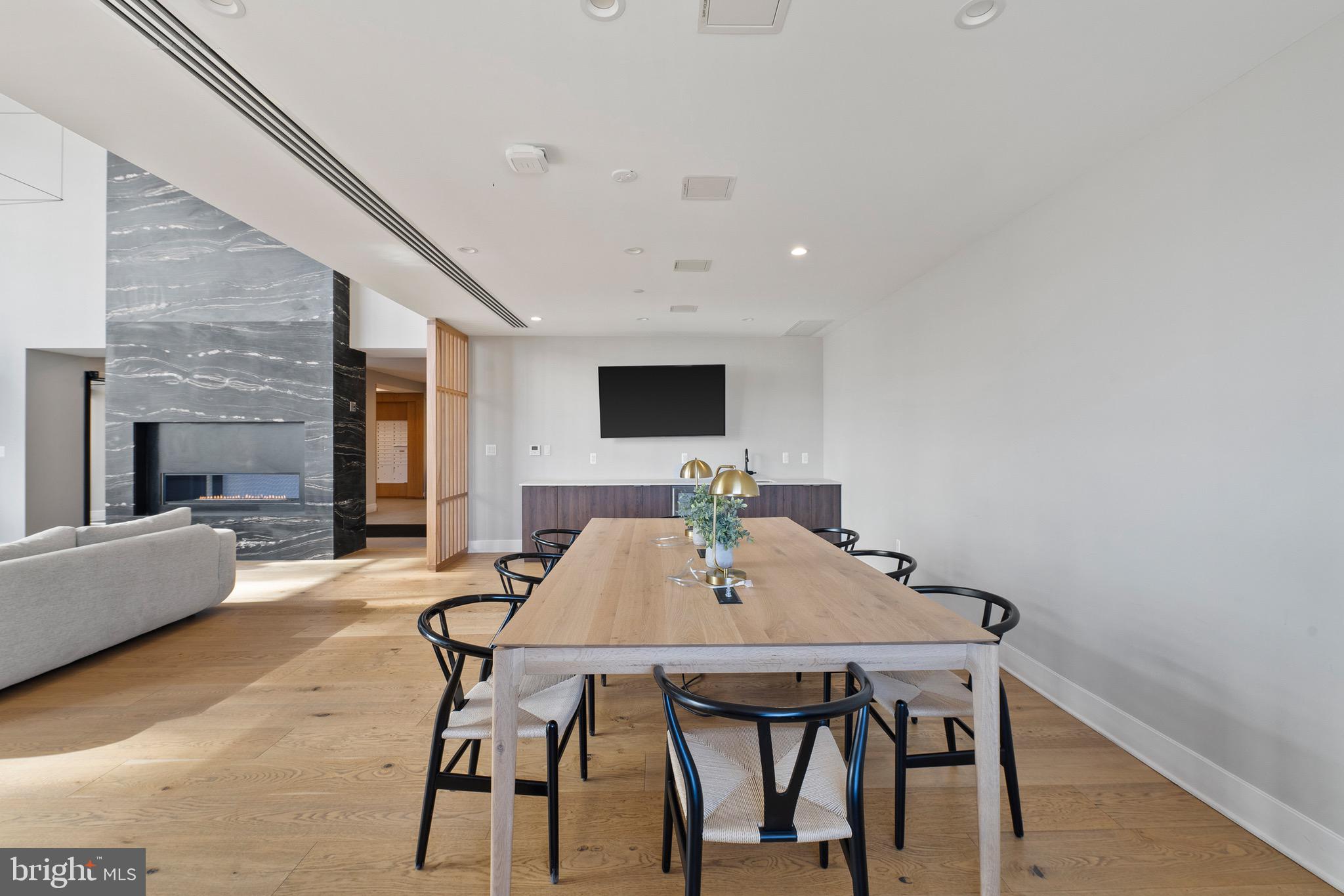 37 L Street Southeast, Unit 908 Washington, DC 20003 - Photo 15 of 20 a view of a dining room with furniture and wooden floor