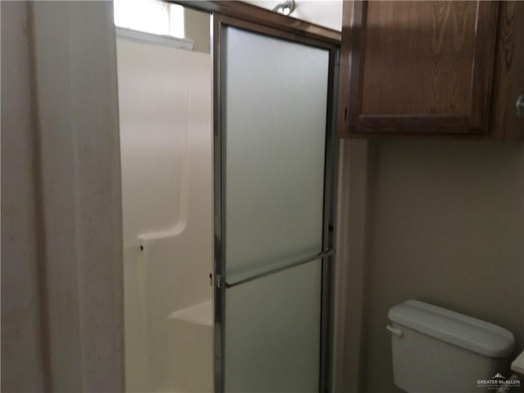 2002 Angus Street Mission, TX 78572 - Photo 9 of 9 a bathroom with a toilet