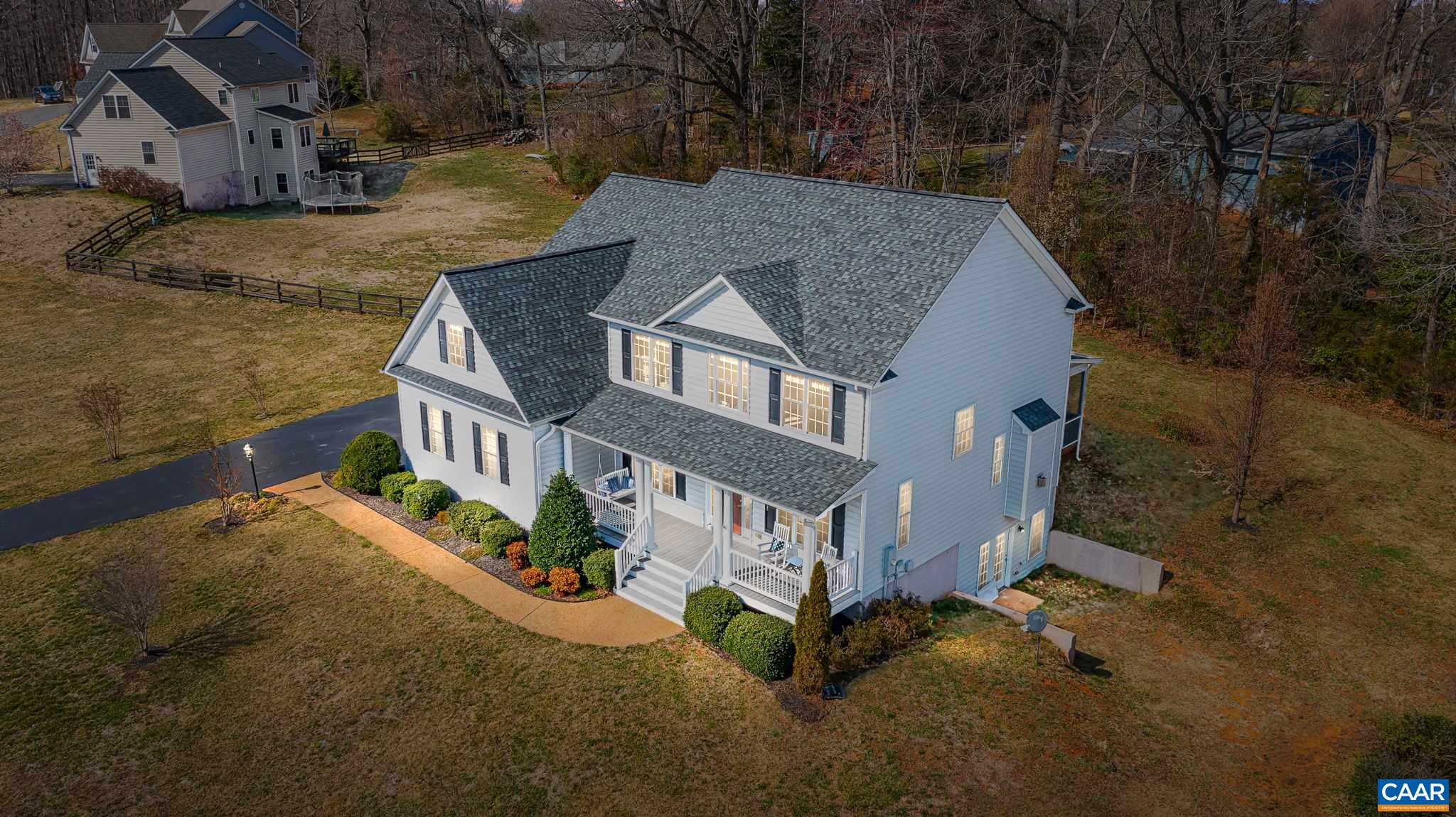 a aerial view of a house with a yard