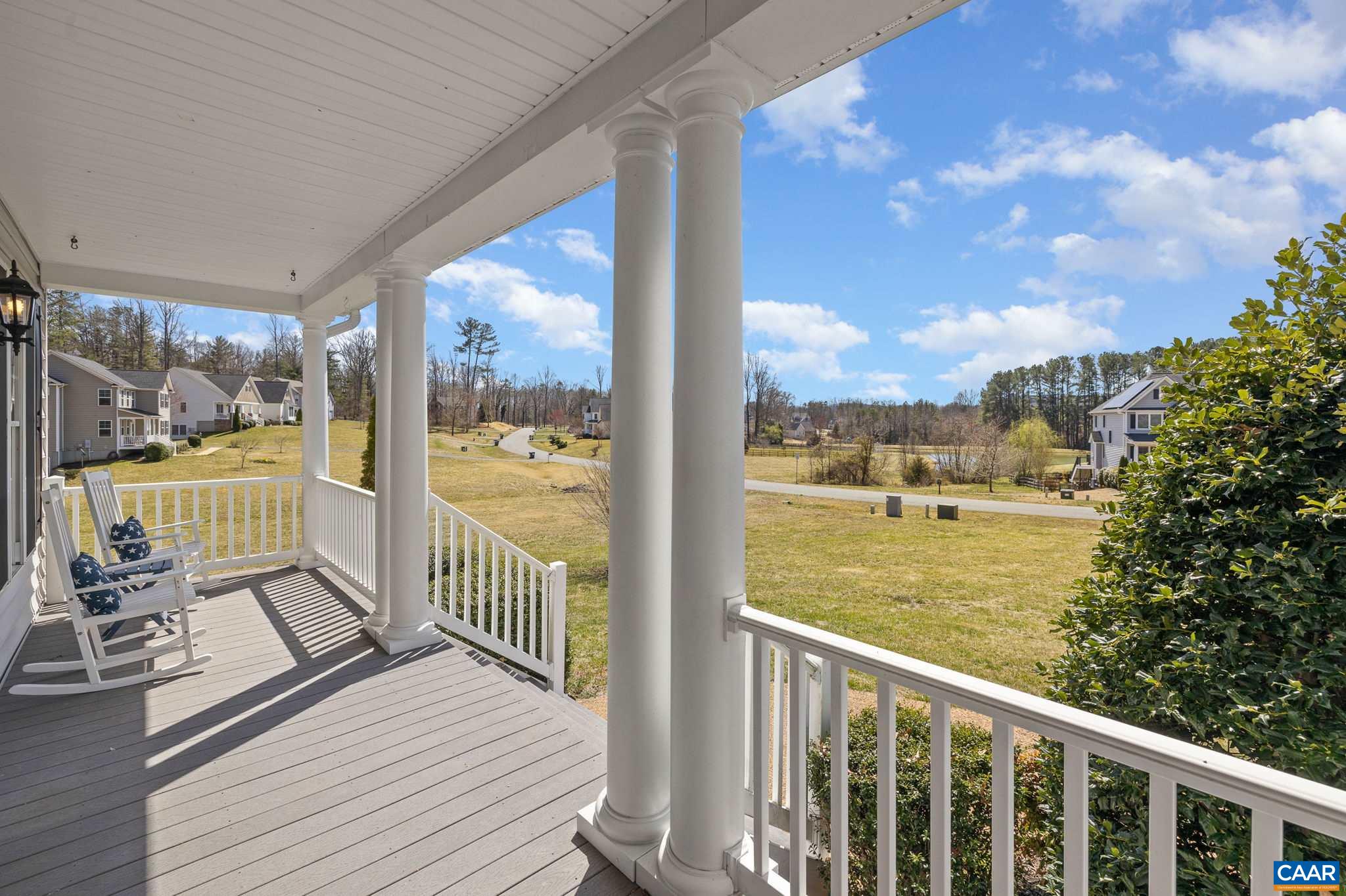 212 Wexford Ridge Road Ruckersville, VA 22968 - Photo 15 of 73 a view of a balcony with floor to ceiling windows with wooden floor