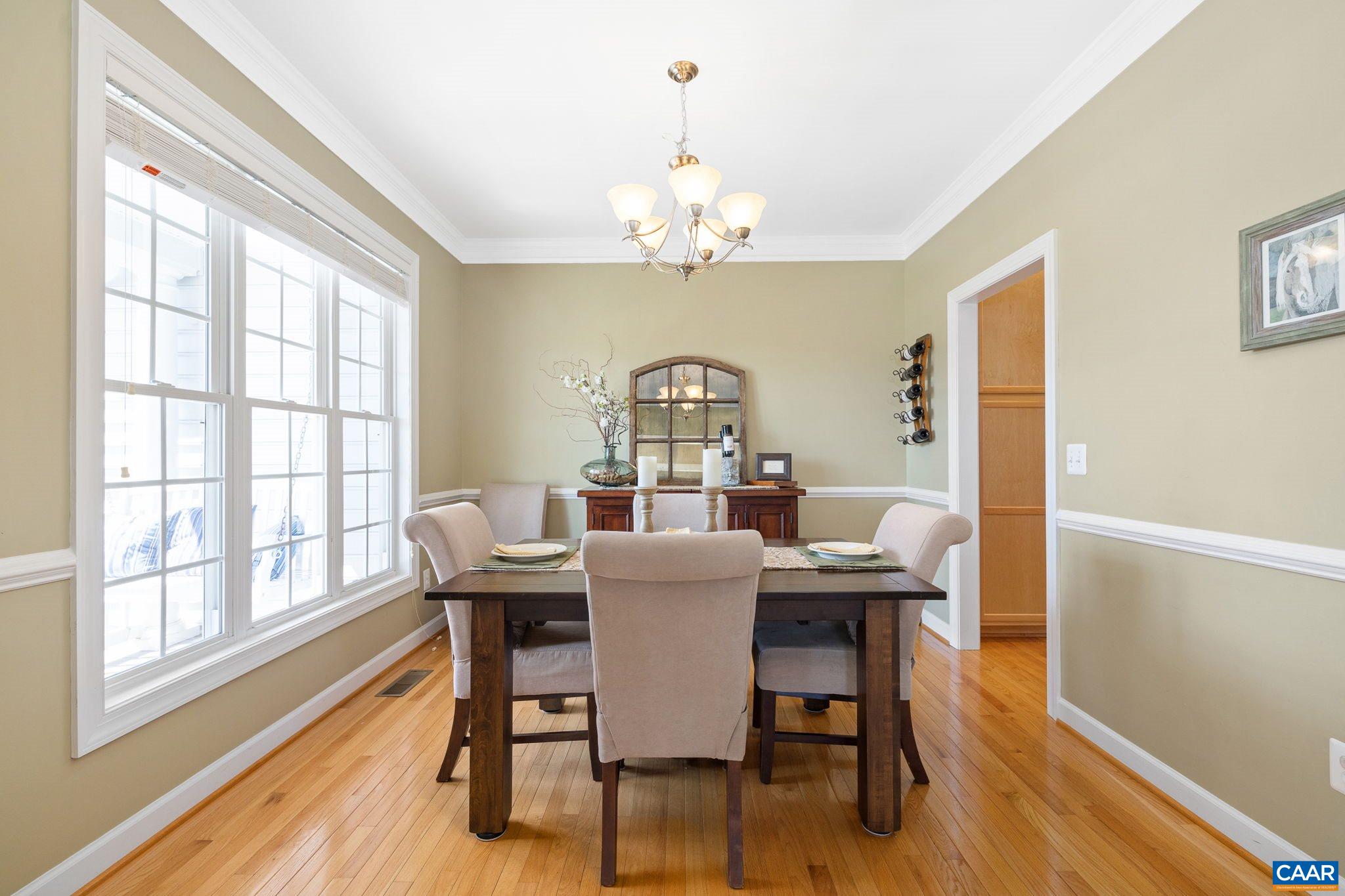 212 Wexford Ridge Road Ruckersville, VA 22968 - Photo 20 of 73 a view of a dining room with furniture window and wooden floor