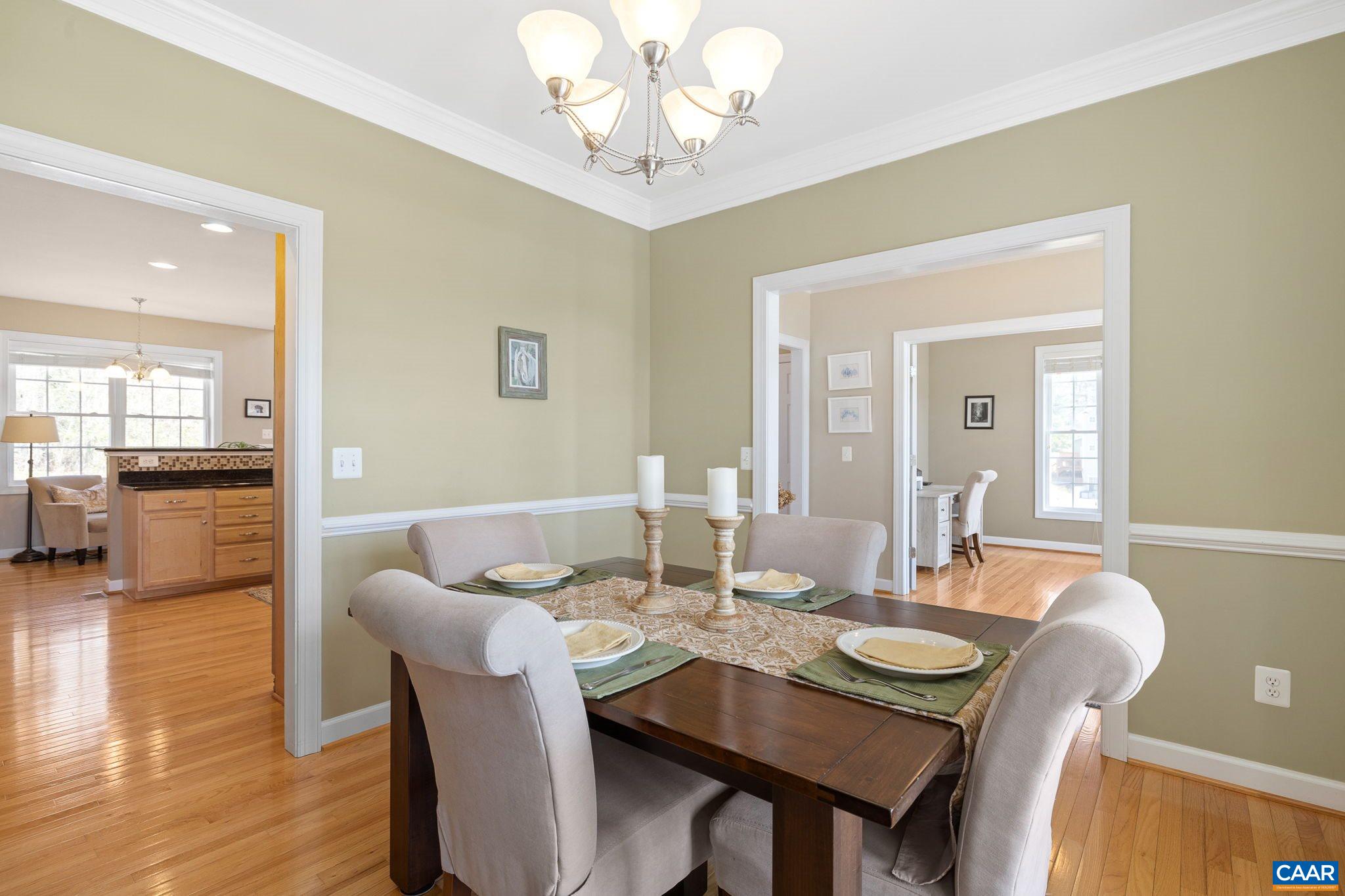 212 Wexford Ridge Road Ruckersville, VA 22968 - Photo 22 of 73 a dining room with furniture and wooden floor