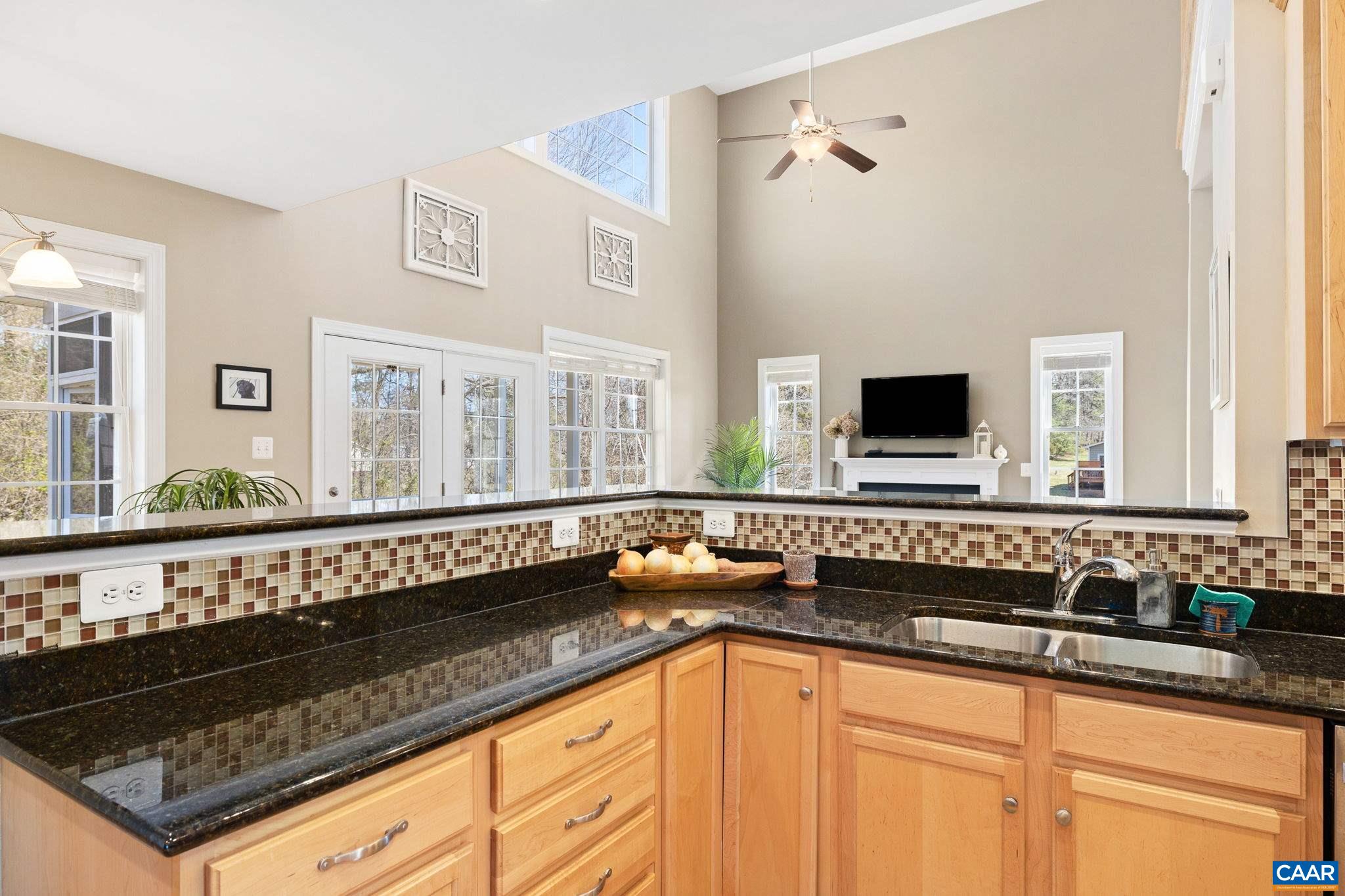 212 Wexford Ridge Road Ruckersville, VA 22968 - Photo 26 of 73 a kitchen with stainless steel appliances a sink dishwasher a stove and a microwave oven