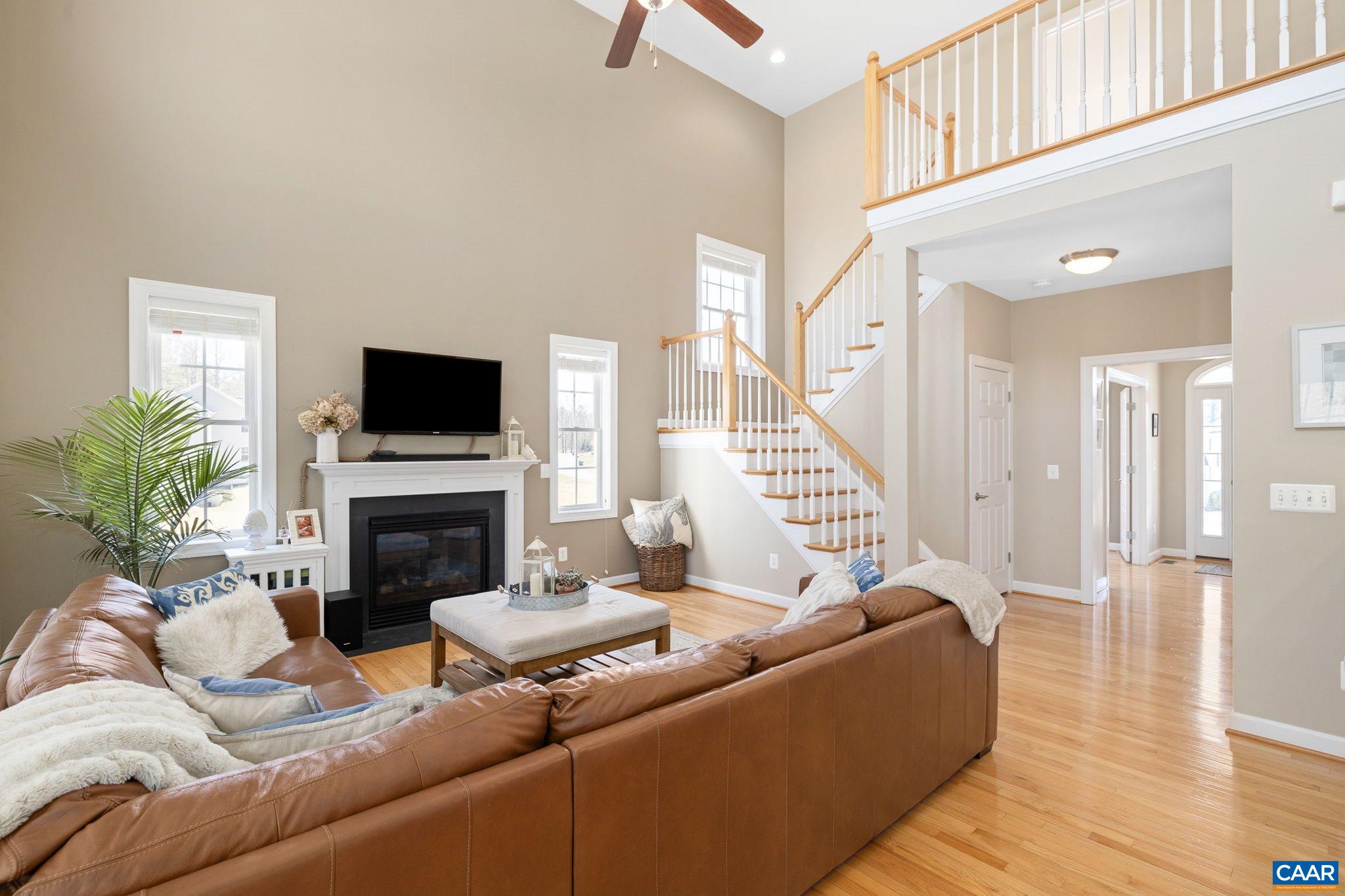 212 Wexford Ridge Road Ruckersville, VA 22968 - Photo 38 of 73 a living room with furniture and a fireplace