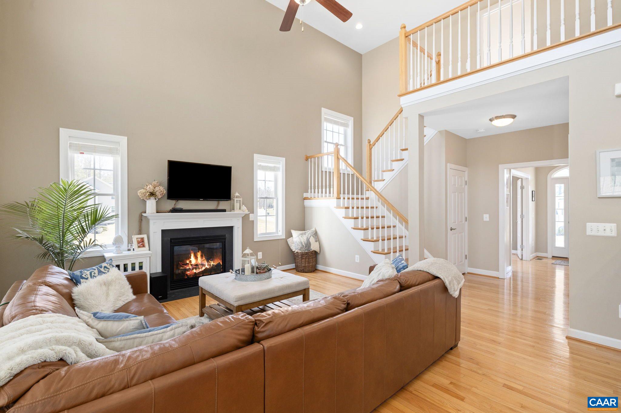 212 Wexford Ridge Road Ruckersville, VA 22968 - Photo 39 of 73 a living room with furniture and a fireplace