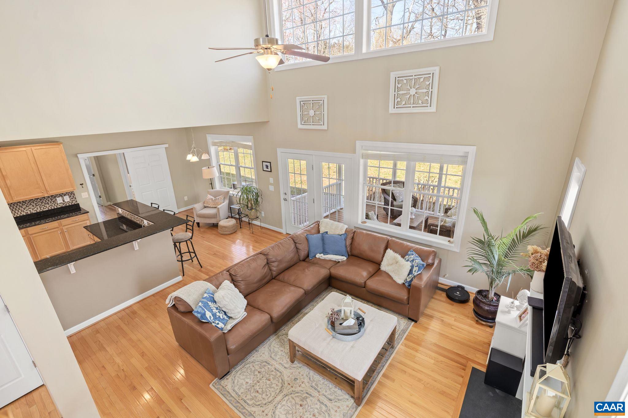 212 Wexford Ridge Road Ruckersville, VA 22968 - Photo 46 of 73 a living room with furniture and a flat screen tv