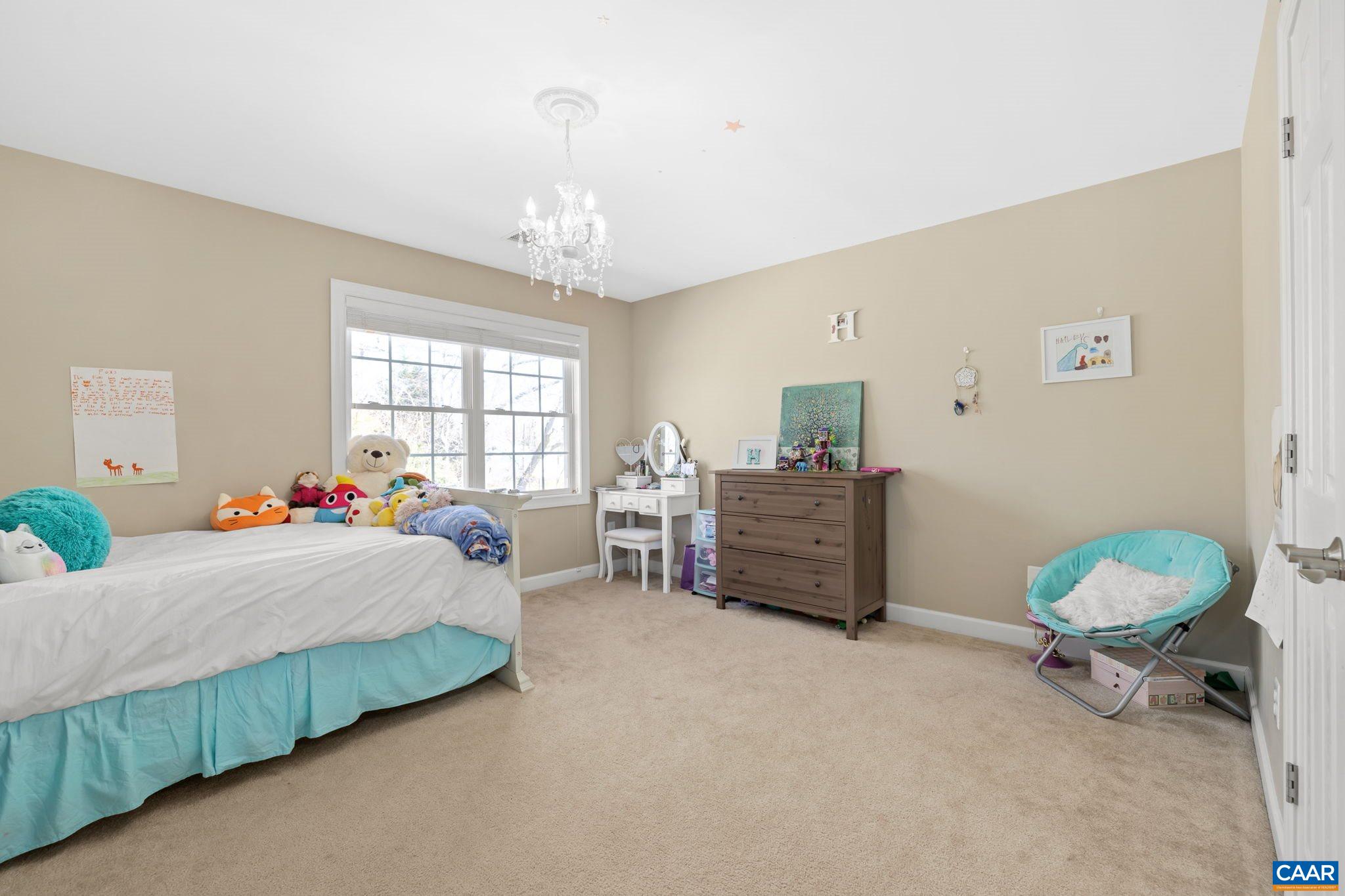 212 Wexford Ridge Road Ruckersville, VA 22968 - Photo 50 of 73 a bed room with a bed and a chair