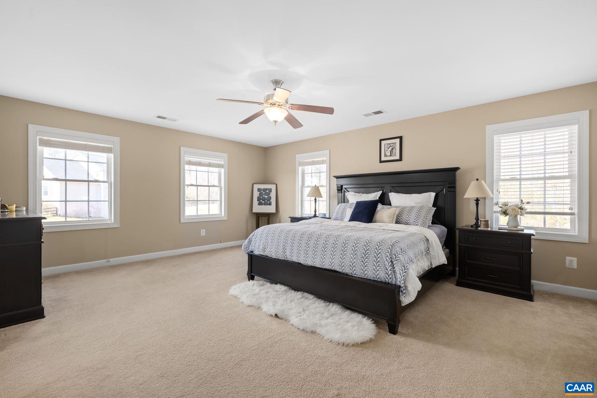 212 Wexford Ridge Road Ruckersville, VA 22968 - Photo 53 of 73 a spacious bedroom with a bed and a window
