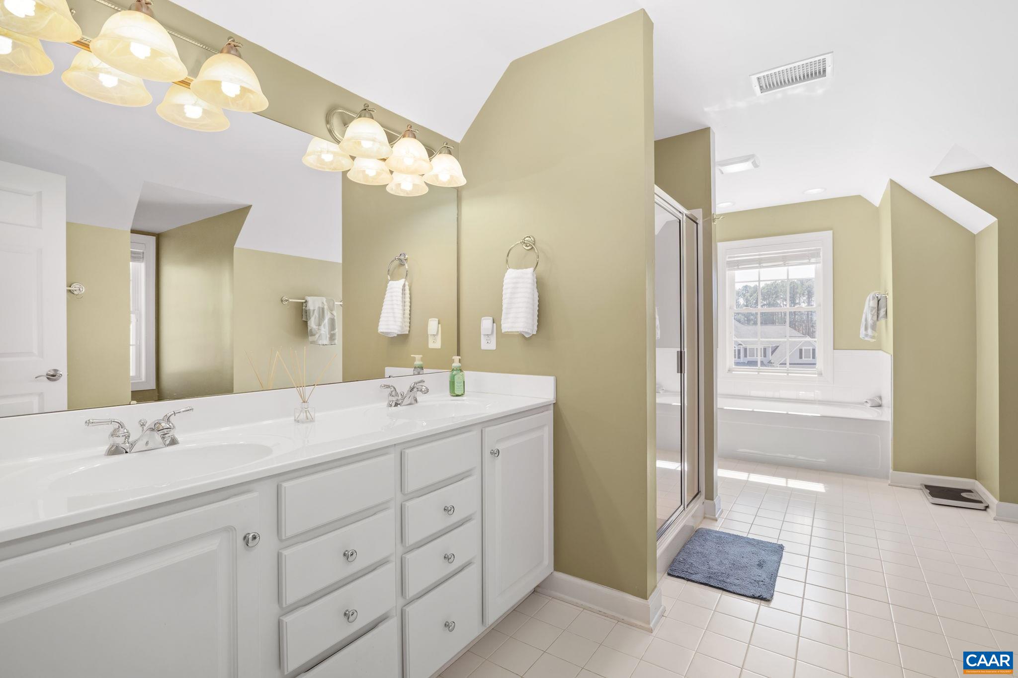 212 Wexford Ridge Road Ruckersville, VA 22968 - Photo 56 of 73 a bathroom with a sink vanity granite and a mirror