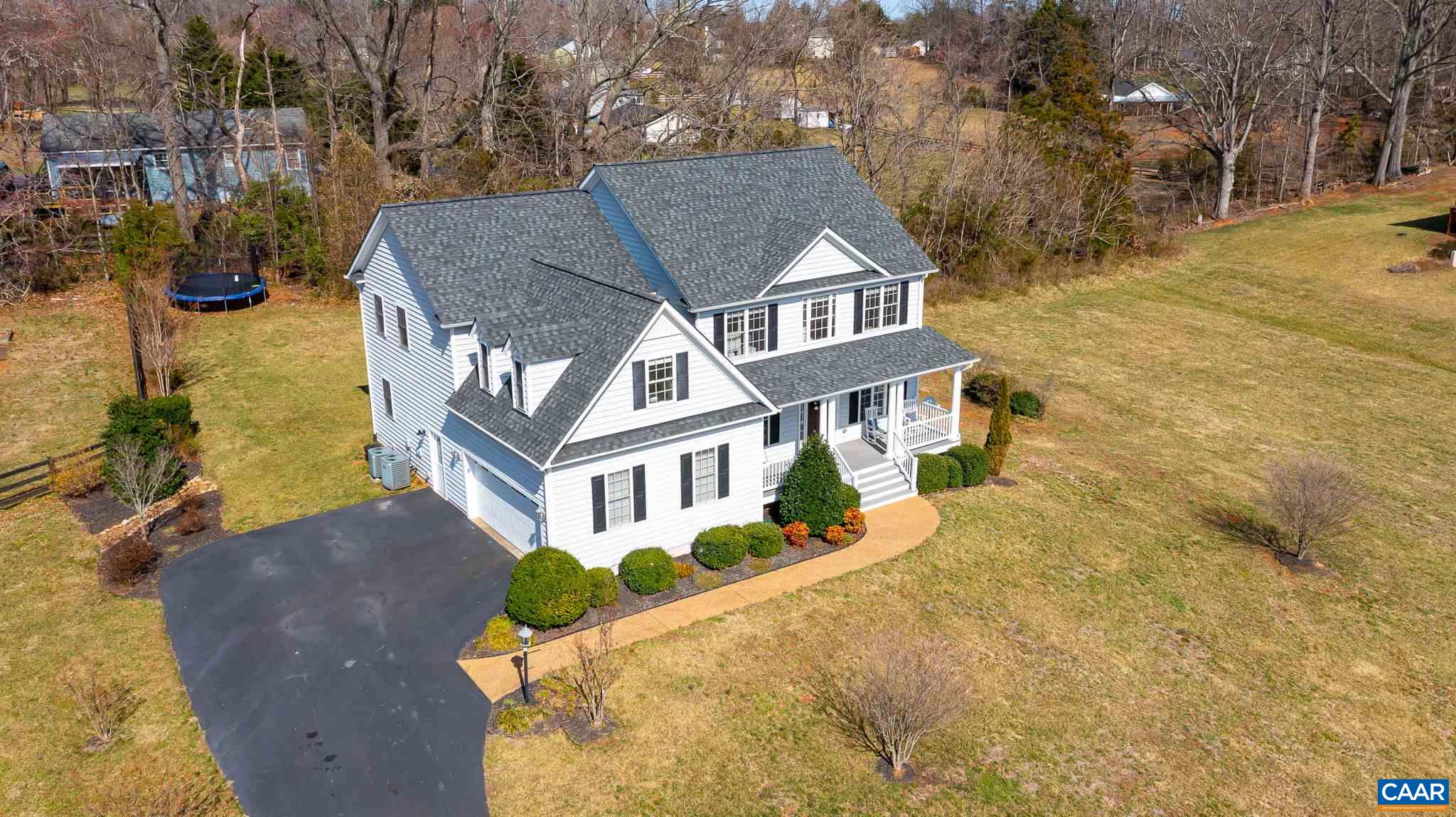 212 Wexford Ridge Road Ruckersville, VA 22968 - Photo 71 of 73 a view of a white house with a yard and sitting area
