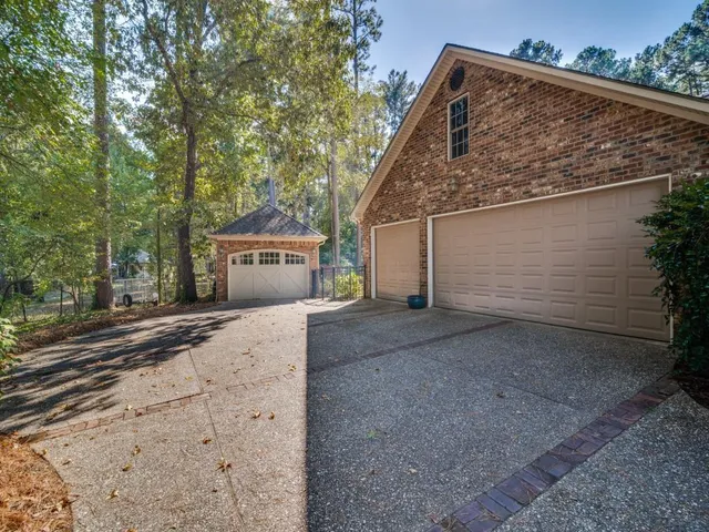a view of a house with a yard and garage