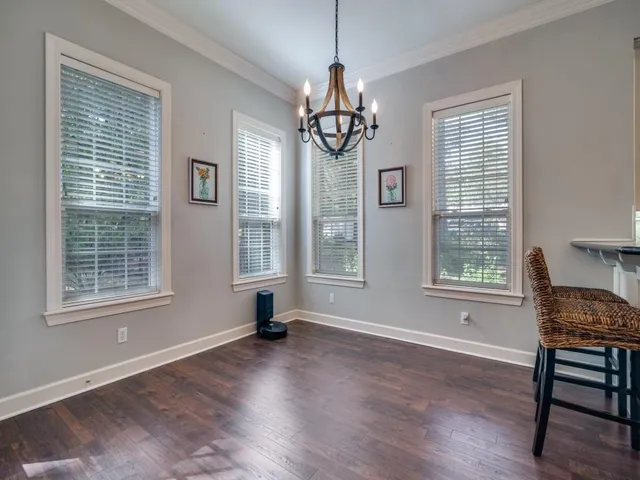 a view of livingroom with furniture wooden floor and windows
