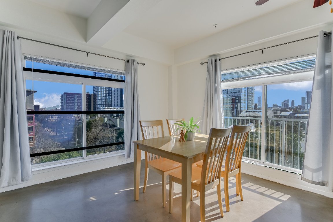 910 West 25th Street, Unit 607 Austin, TX 78705 - Photo 5 of 19 a view of a dining room with furniture and front door