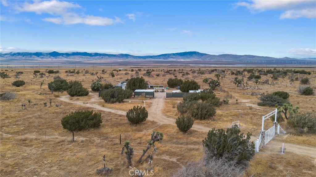 a view of a terrace with a table and chairs