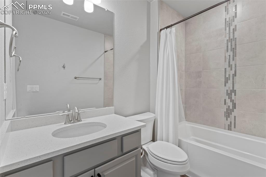 15777 Little Bluestem Road Monument, CO 80132 - Photo 41 of 50 a bathroom with a sink toilet and shower