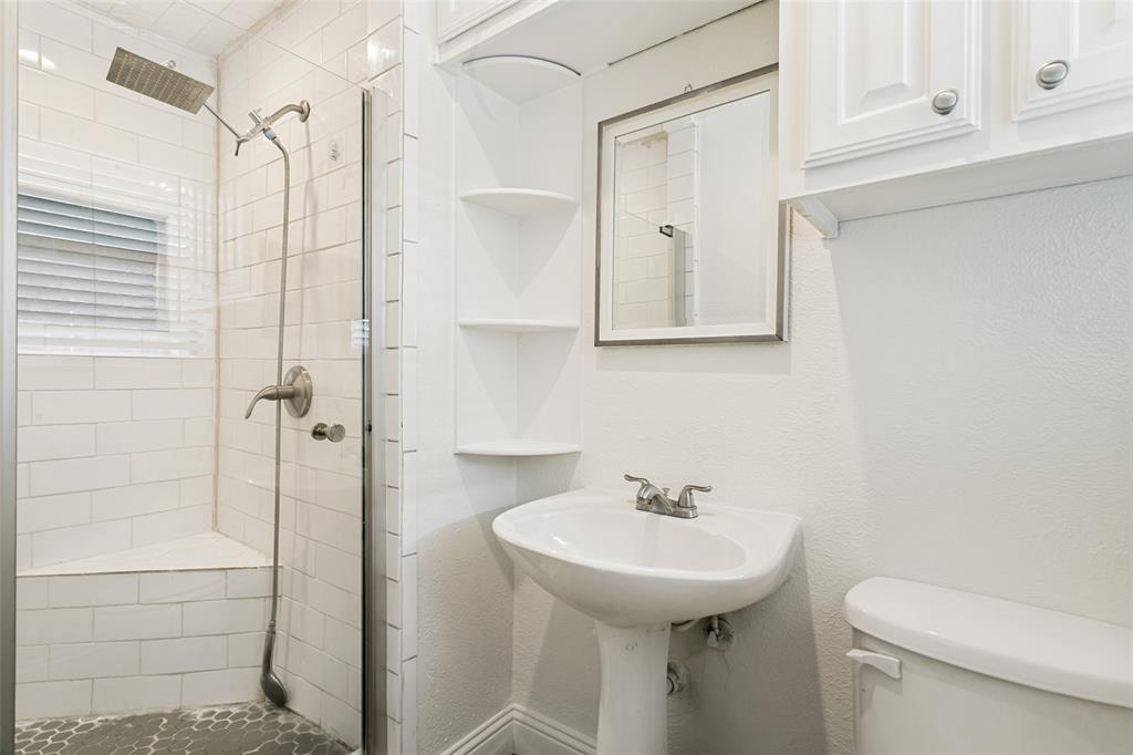 1904 Old Kirk Road Bedford, TX 76022 - Photo 22 of 25 a bathroom with a sink a toilet and shower