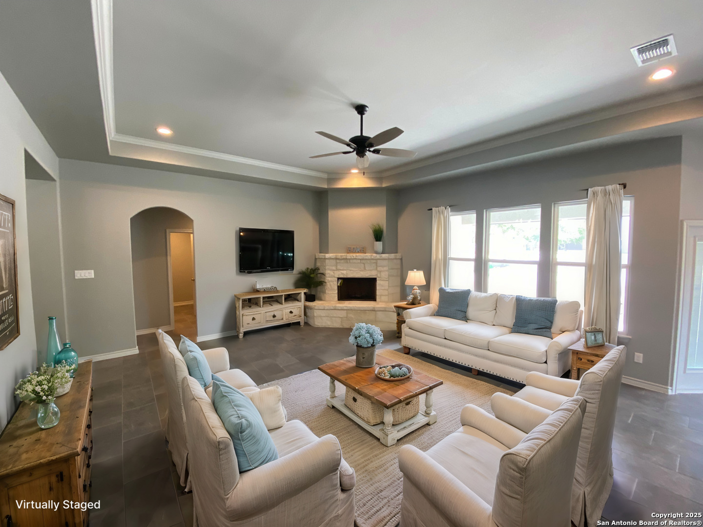 120 South Calvin Barrett Blanco, TX 78606 - Photo 2 of 18 a living room with furniture a fireplace and a flat screen tv