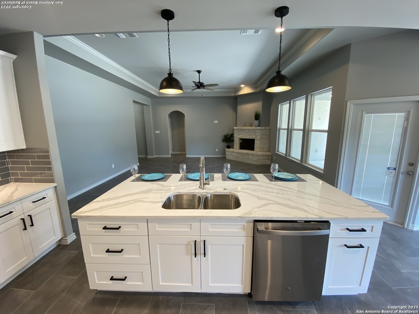120 South Calvin Barrett Blanco, TX 78606 - Photo 5 of 18 a room with kitchen island a sink and a chandelier