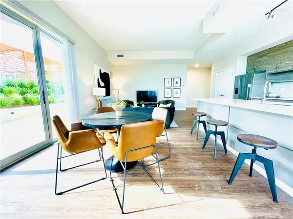 a view of a dining room with furniture window and outside view