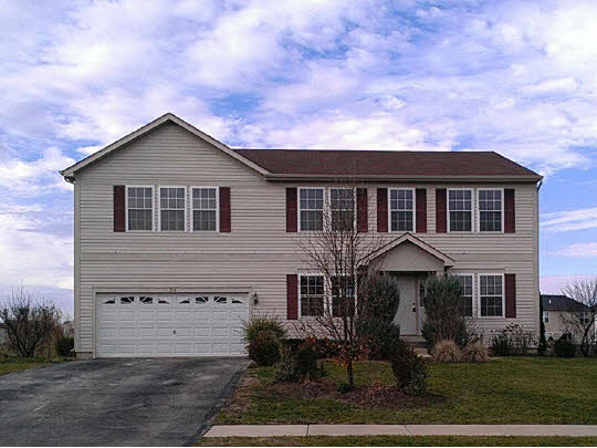 216 Ridgestone Trail Poplar Grove, IL 61065 - Photo 1 of 11 a front view of a house with yard