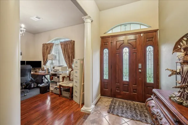 a view of living room filled with furniture and furniture