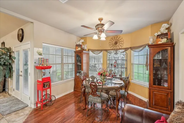a view of a dining room with furniture window and outside view