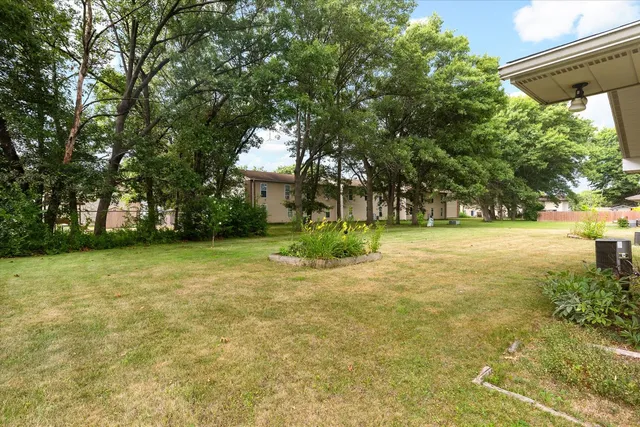 a view of a trees in front of a house